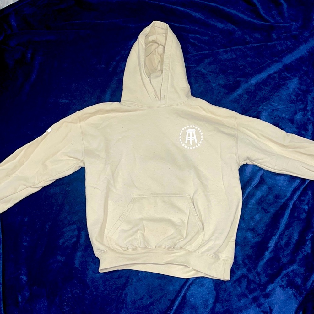Barstool Hoodie that says hungover on the arm.